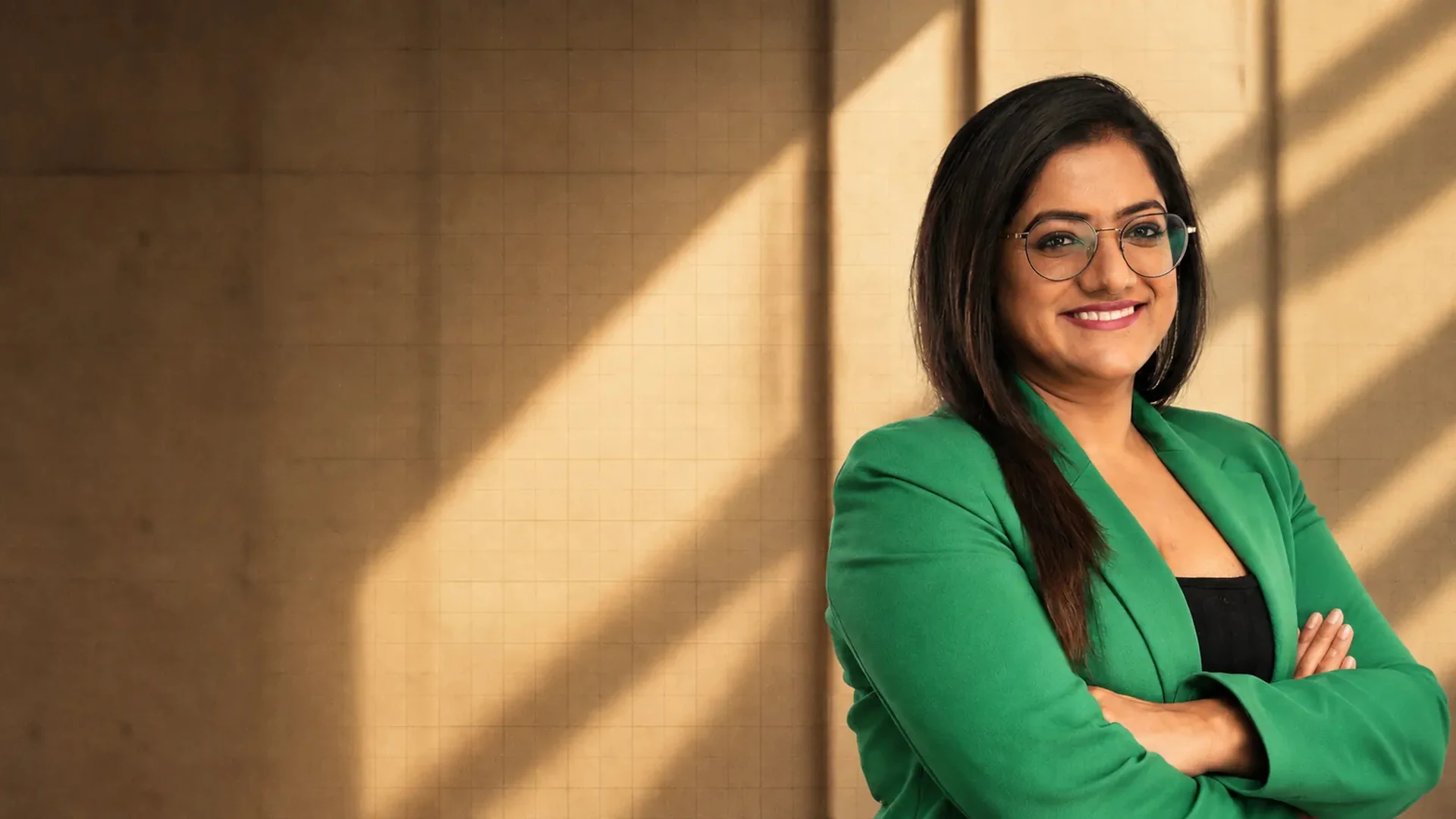 Nidhi Rungta, Founder and CEO of Invest My Paisa, smiling with her arms folded